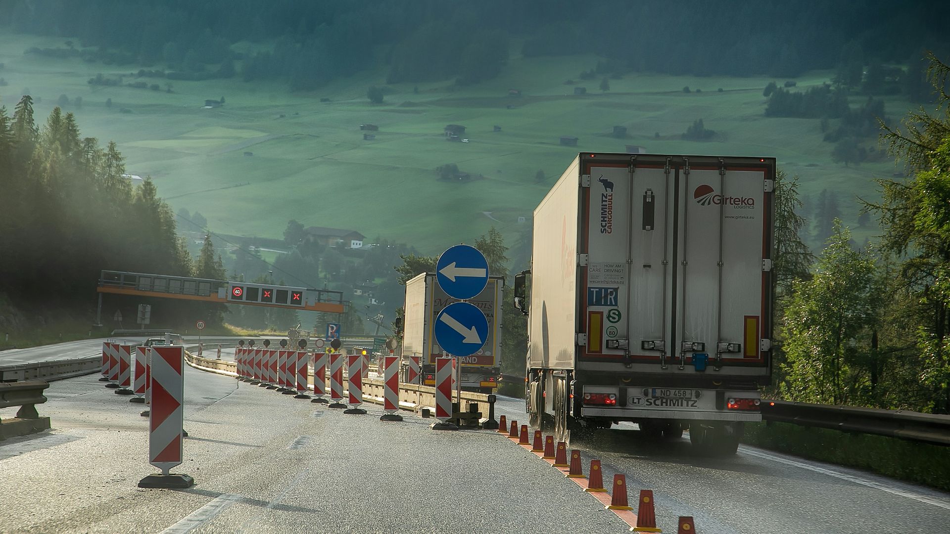 white and blue truck on road during daytime