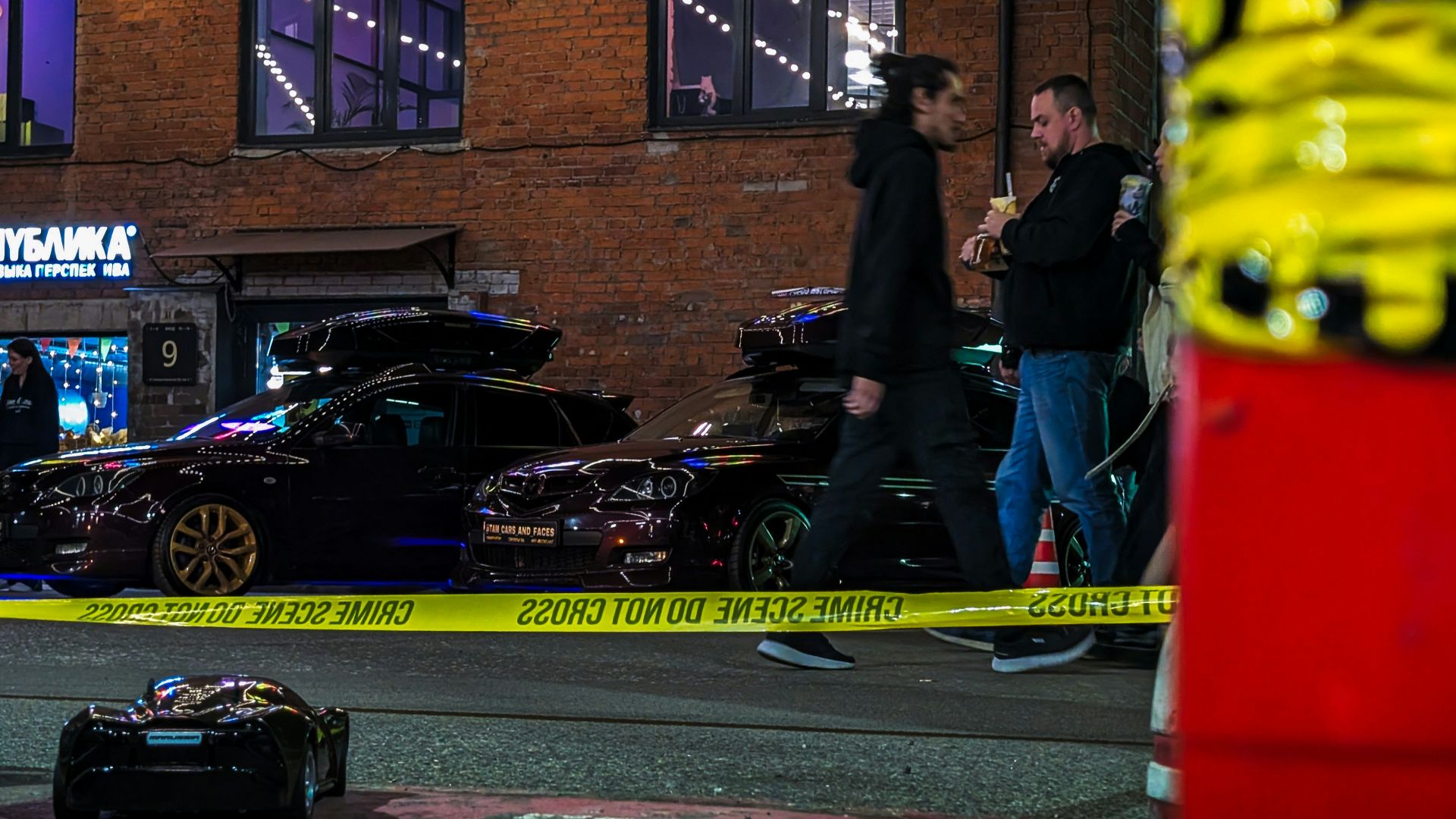 Cars parked on a city street at night