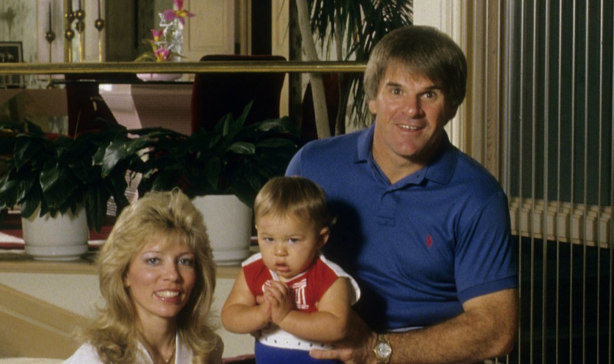 Outfielder Pete Rose (R) of the Cincinnati Reds holds his son Pete Rose Jr. on his knee and Wife Karolyn Rose (L) poses for this portrait in their home in Cincinnati, Ohio. Rose Played for the Reds from 1963-78.