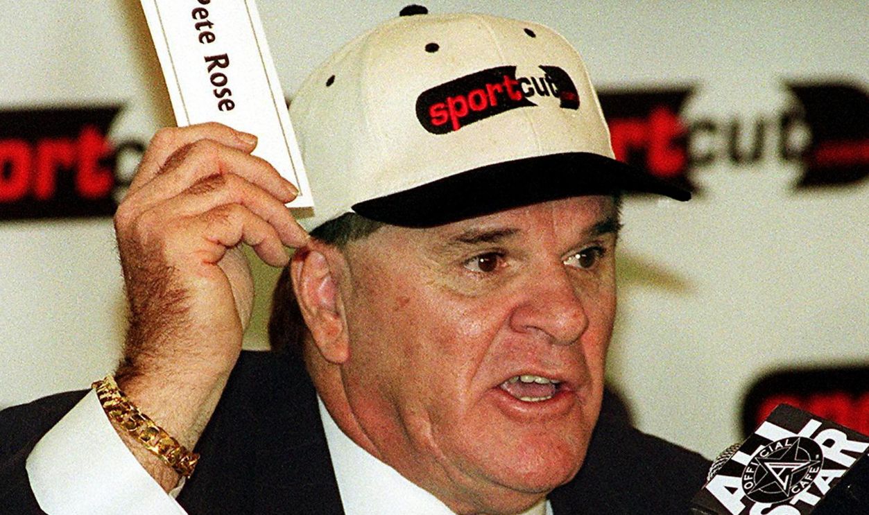 This 30 November 1999 file photo in New York shows former Cincinnati Reds player and manager Pete Rose, who was banned from the game in 1989 for allegedly gambling on baseball, uses his name tag to make a point about a petition which he launched on the Internet designed to convince Major League Baseball that he be reinstated and allowed to participate in baseball. In an interview to be broadcast 08 January 2004 by ABC News, Rose ends 15 years of denials by admitting he bet on baseball games in 1987 and 1988. His admission, considered a first step towards his reinstatement in baseball and a possible entry into the Baseball Hall of Fame, is expected to feature heavily in his new autobiography, My Prison Without Bars, which will be released 08 January 2004. 