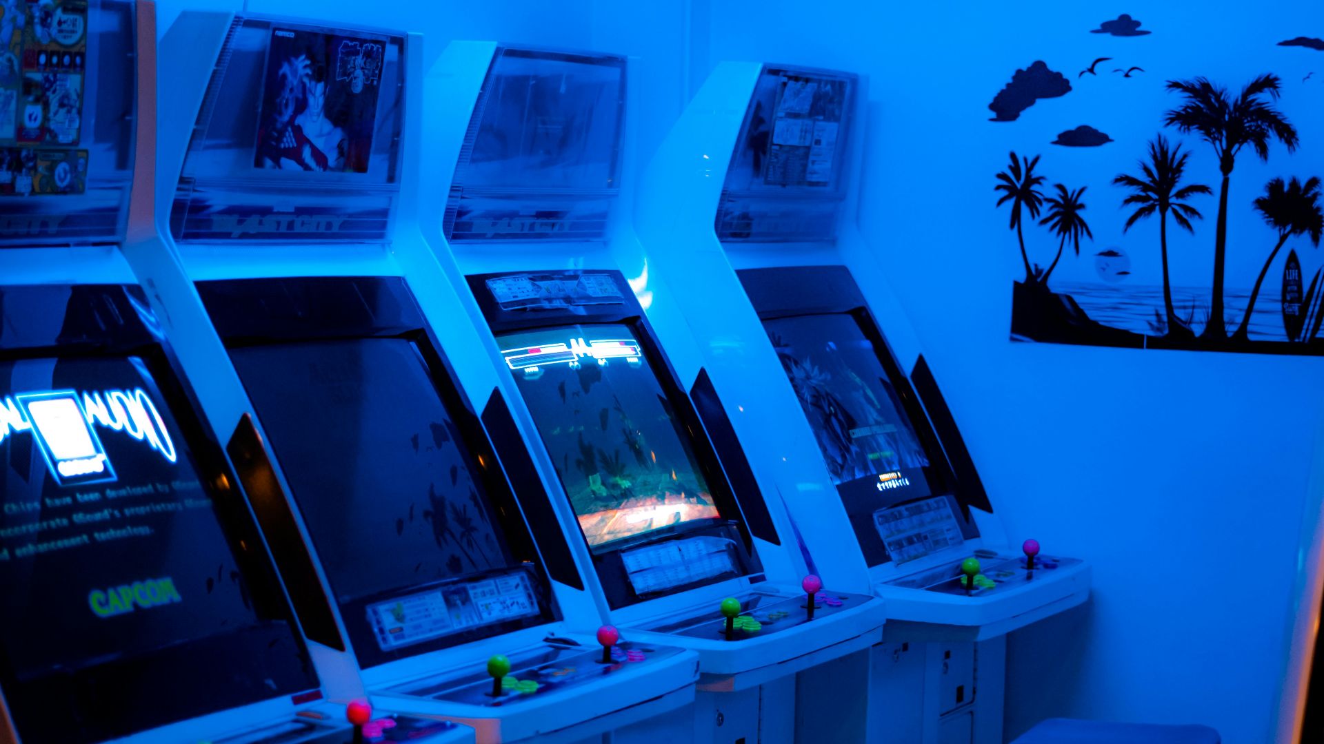 a room with a bunch of arcade machines in it