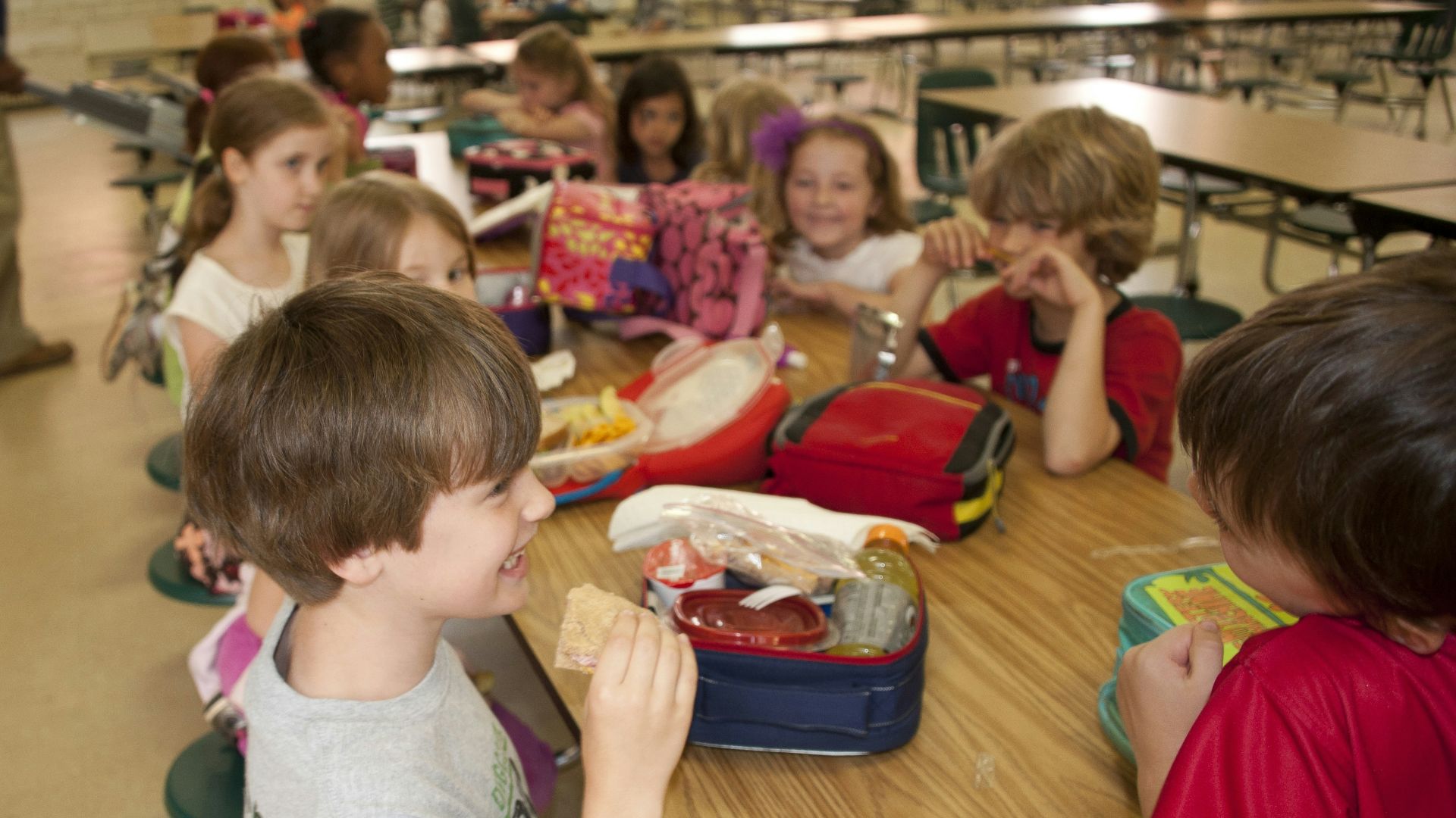 boy in gray crew neck t-shirt eating