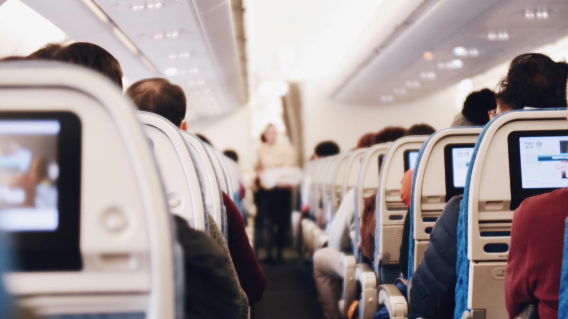 shallow focus photography of people inside of passenger plane