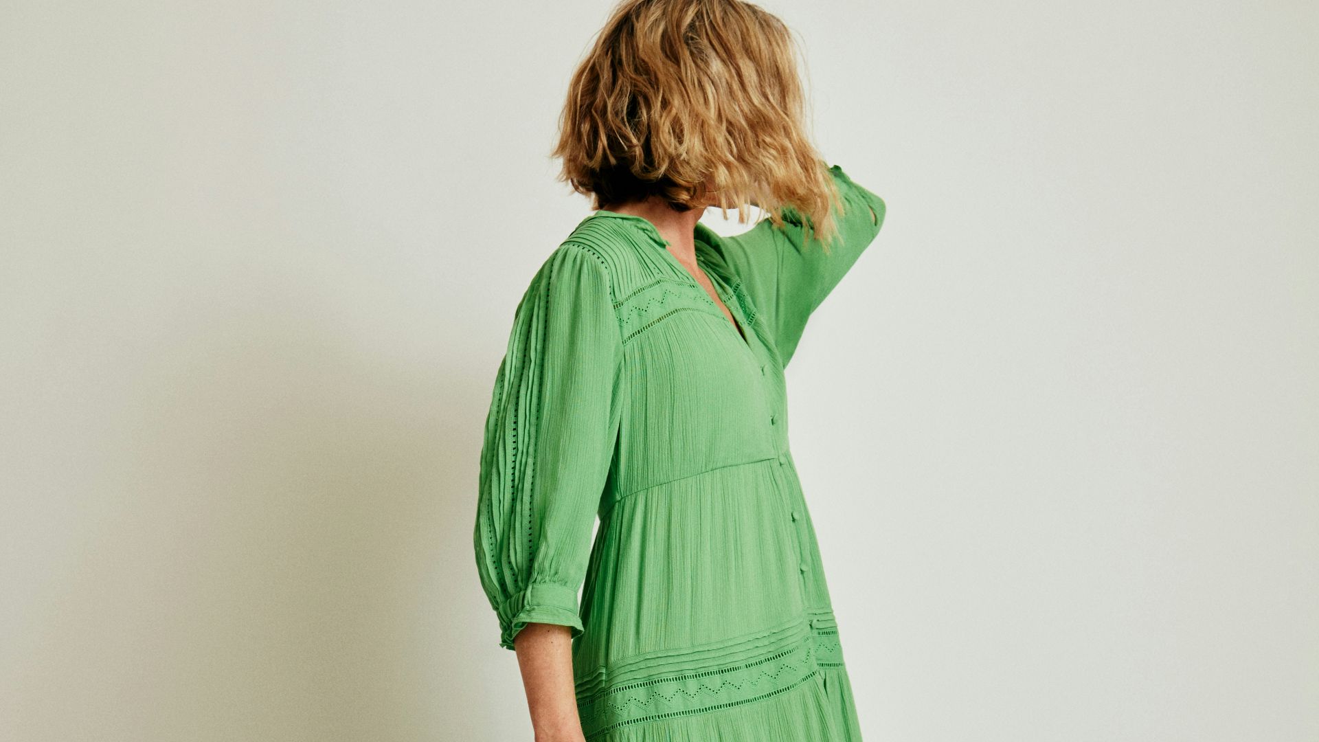 a woman in a long green dress