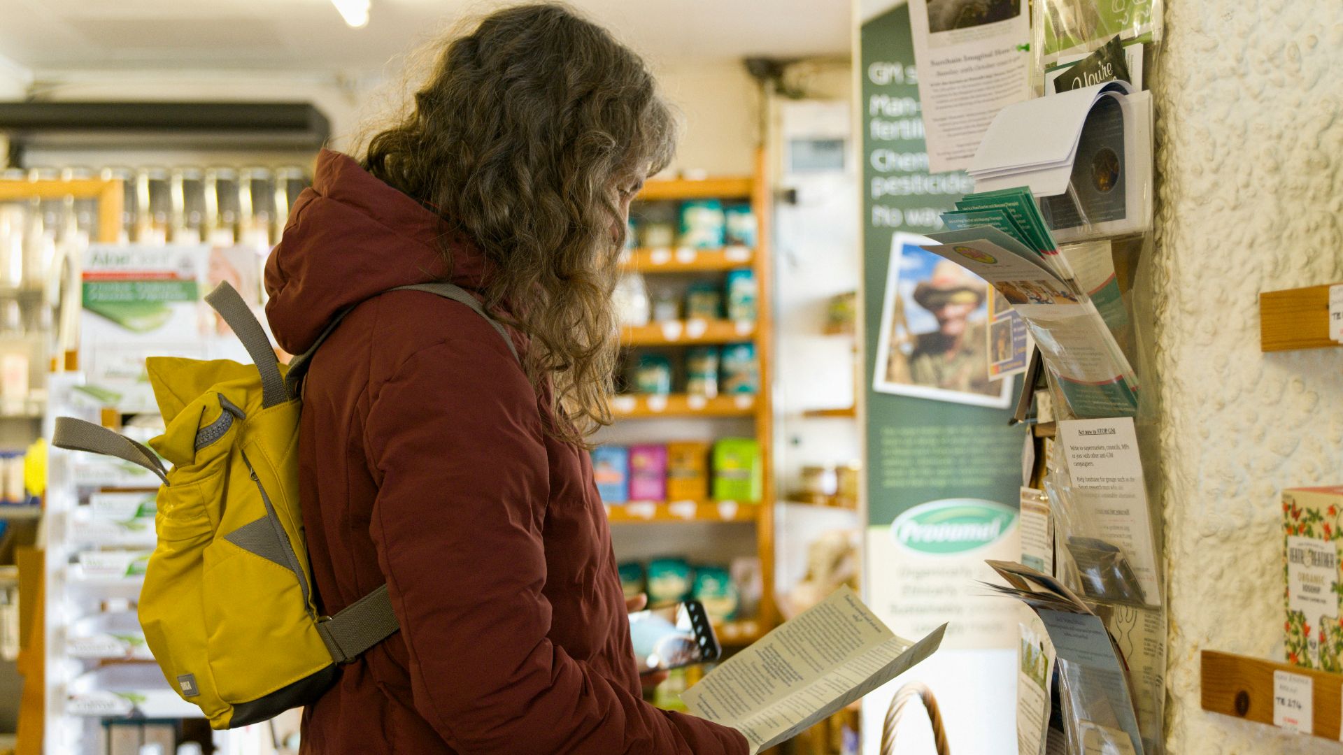 a woman in a store looking at a menu