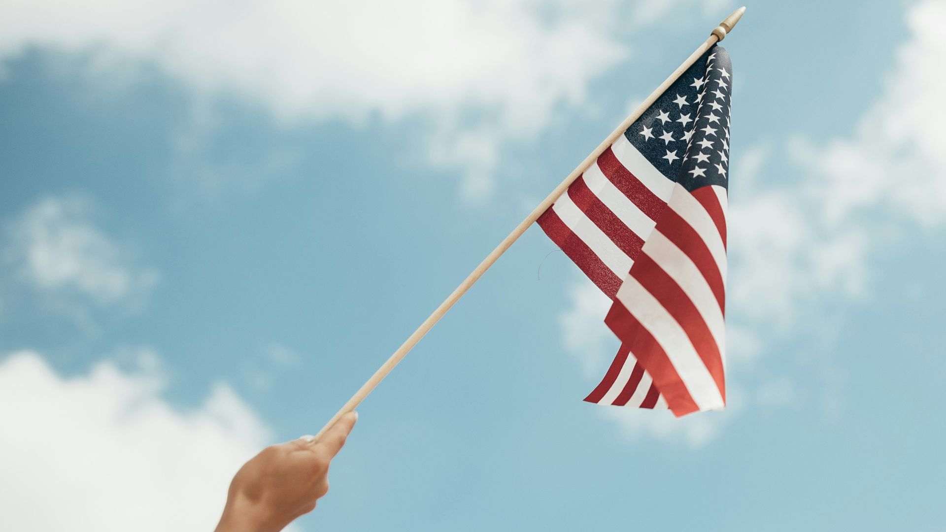 person holding U.S.A. flag