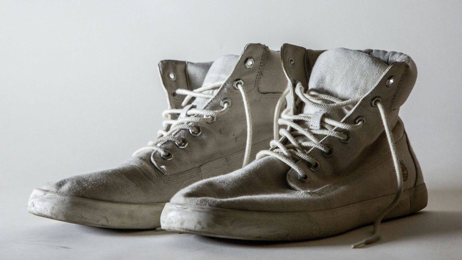 white lace-up high-top shoes