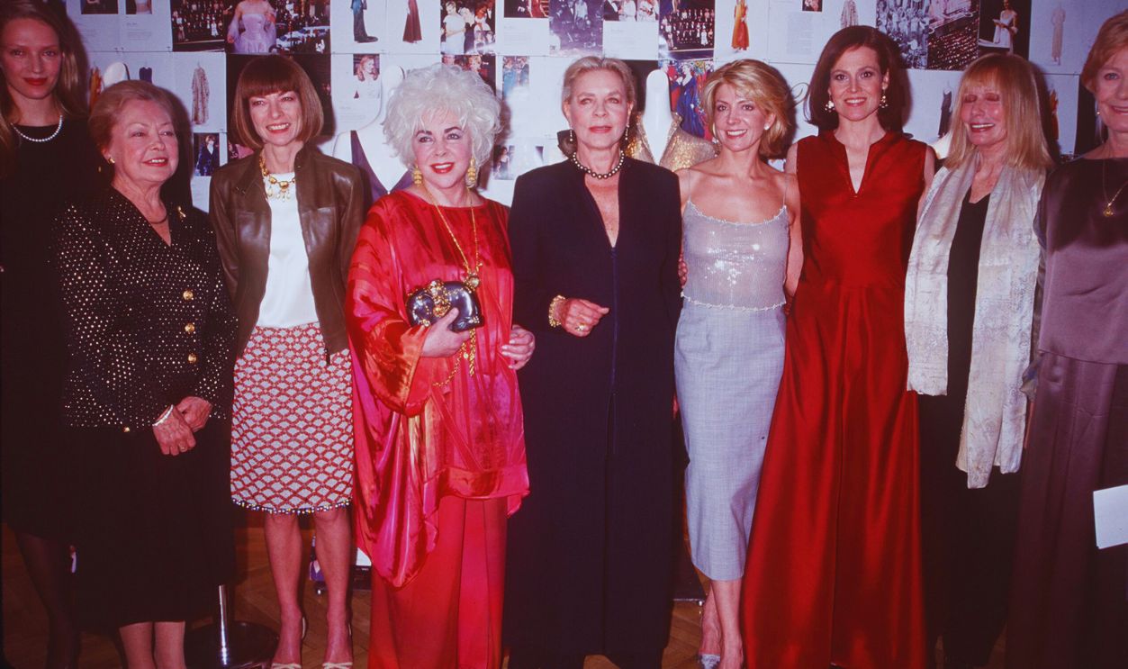 Gettyimages - 852654, 3/15/99 New York, NY. From l-r: Uma Thurman, Dr. Krim, Anna Wintour, Liz Taylor, Lauren Bacall, Natasha Richardson, Sigourney Weaver, Sally Kellerman and Vanessa Redgrave at Christie's for a fundraiser reception to benefit amfAR.