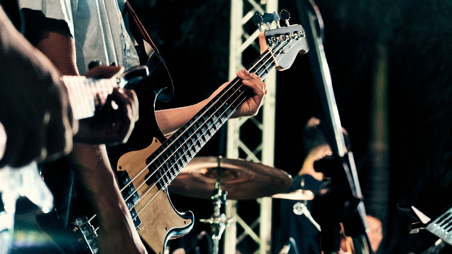 man playing guitar on stage
