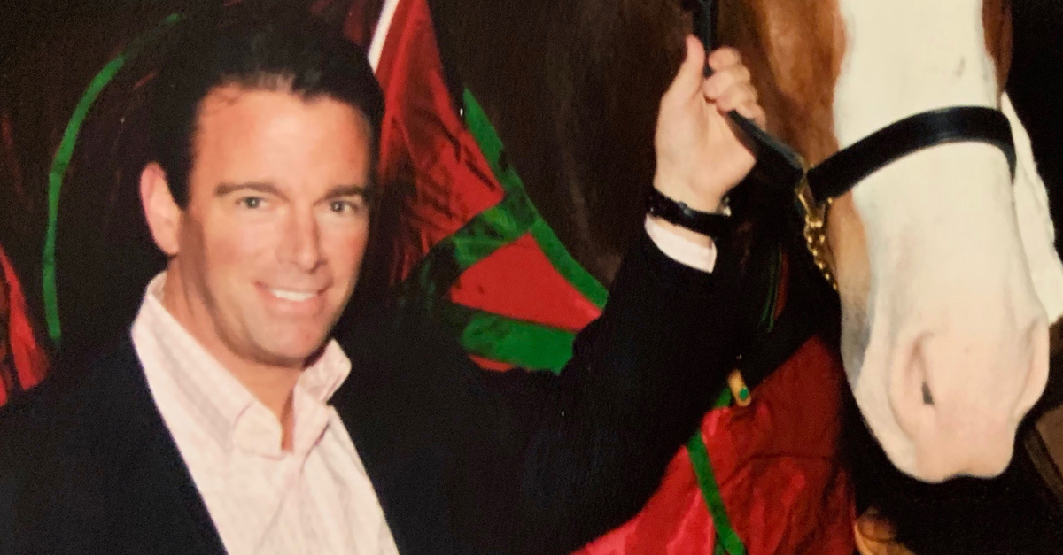 August A. Busch IV with Budweiser Clydesdale