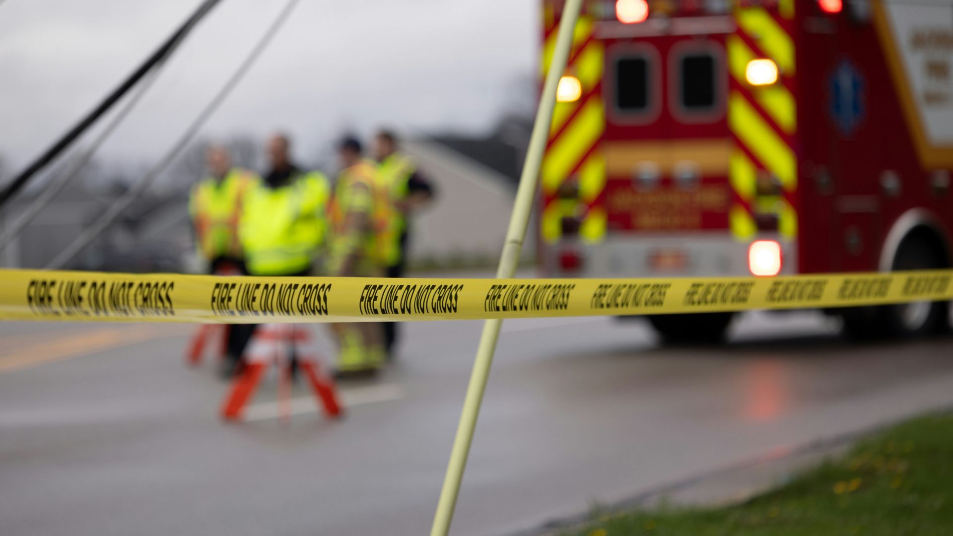 a group of people standing next to a fire truck