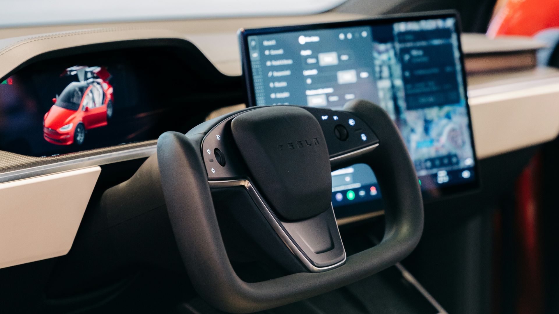 the interior of a car with a laptop on the dashboard