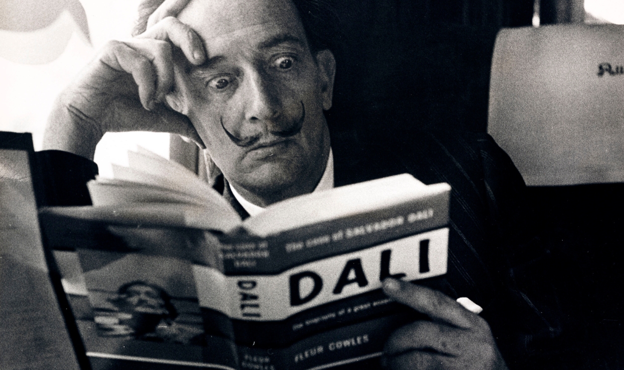 Salvador Dali reading his biography, 6 May, 1959.