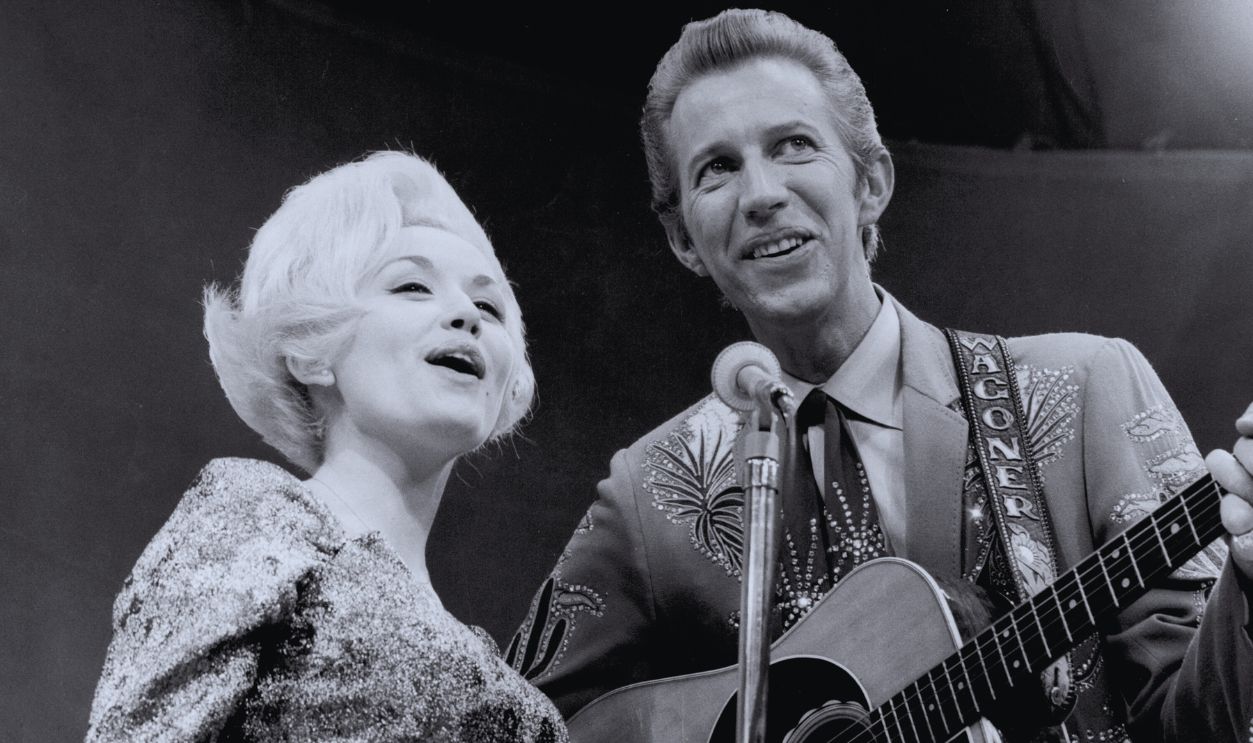Gettyimages - 74289183, Dolly Parton & Porter Wagoner Perform Country singer Dolly Parton and her collaborator Porter Wagoner perform onstage in circa 1967. Mr. Wagoner is wearing a Nudie Suit designed by Nudie Cohn of Nudie's Rodeo Tailors.