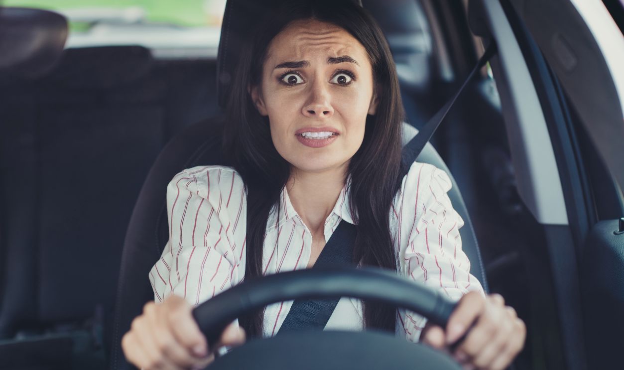 Close-up portrait of her she nice-looking attractive lovely brunette, scared emotional girl riding new car early morning traffic jam bad skills lack of experience