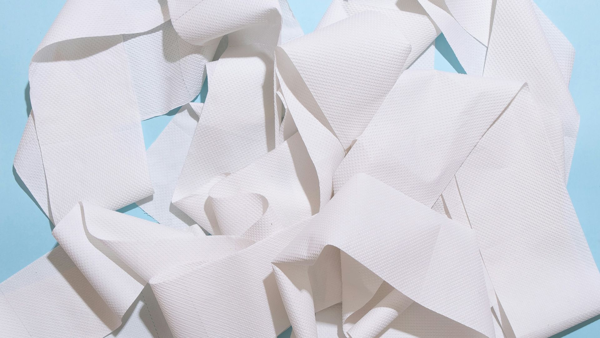 white paper on blue table