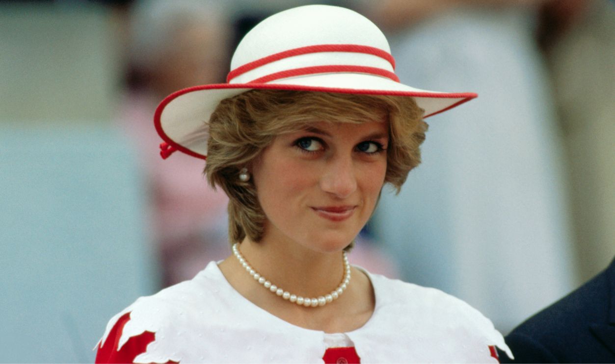Diana, Princess of Wales, wears an outfit in the colors of Canada during a state visit to Edmonton, Alberta, with her husband.