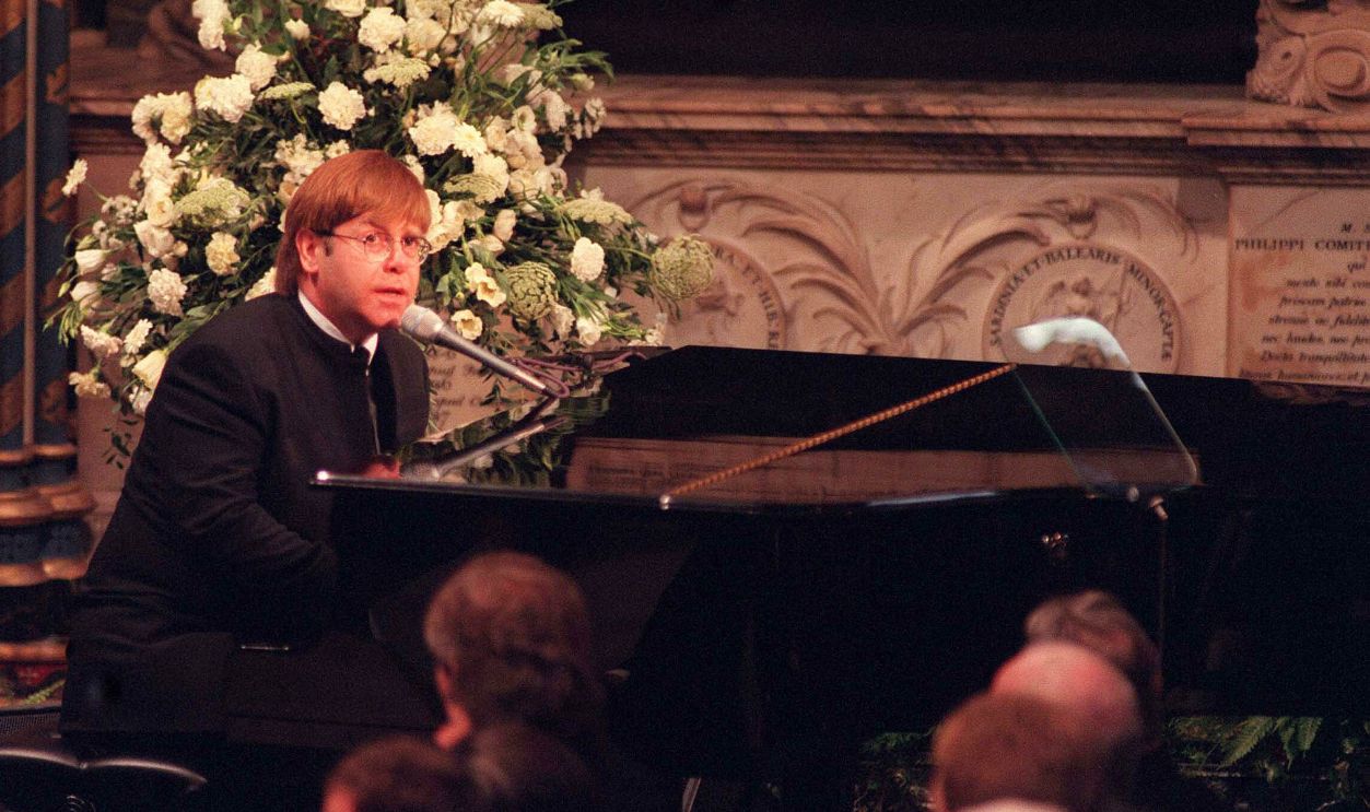Sir Elton John signing 'Candle In The Wind' at the funeral of Diana, Princess of Wales on September 6, 1997. 