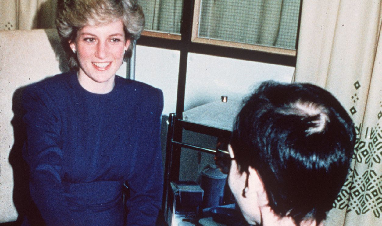 Diana, Princess of Wales shakes hands with a Aids victim as she opens a new Aids ward at the Middlesex Hospital on April 9, 1987 in London, England. 