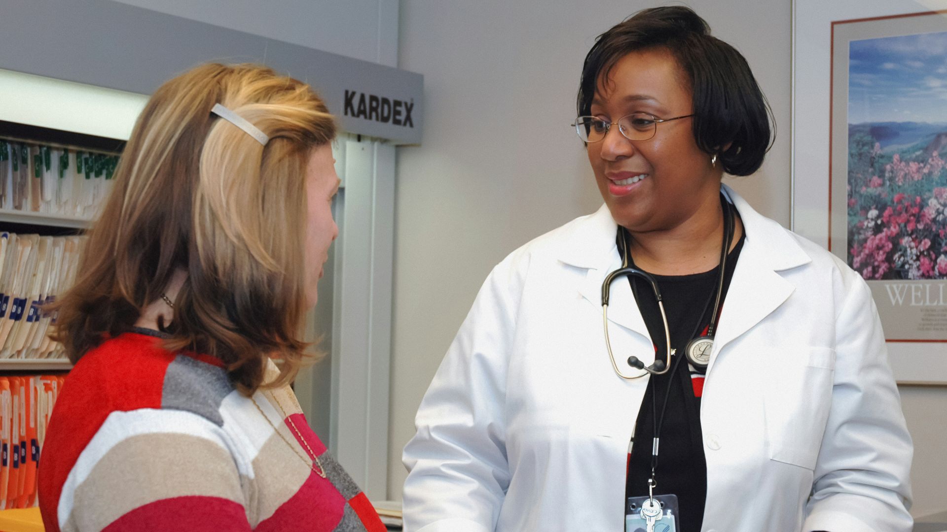 woman in white button up long sleeve shirt holding white card