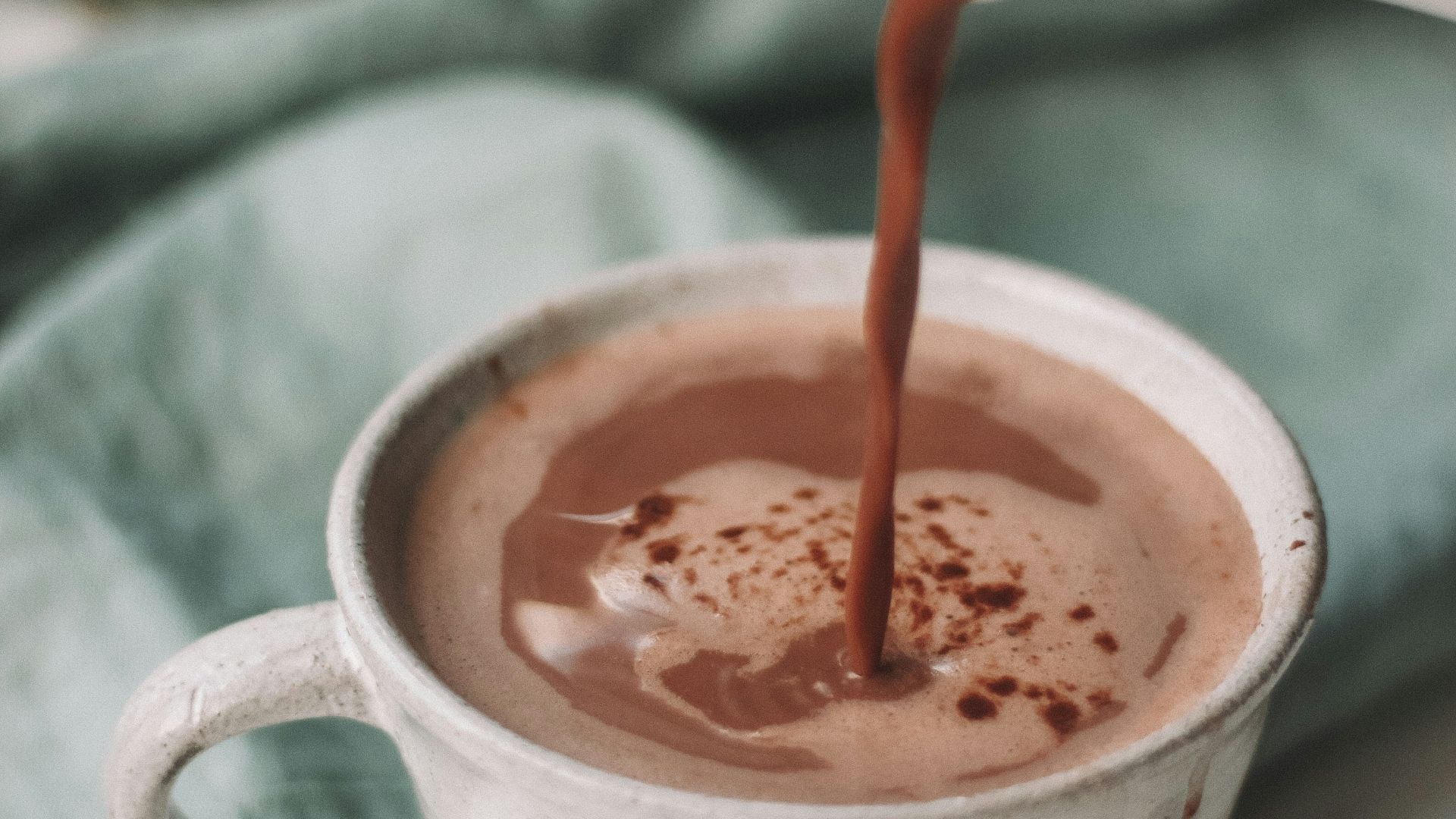 chocolate coffee pouring in white mug