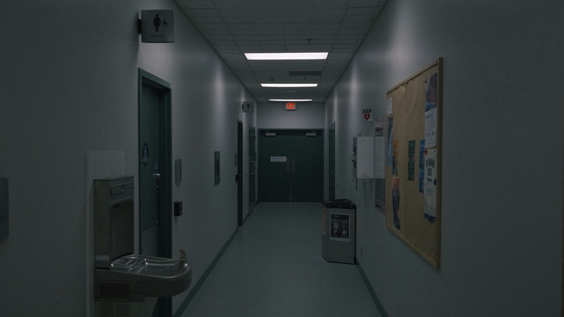 a long hallway with a light on the ceiling