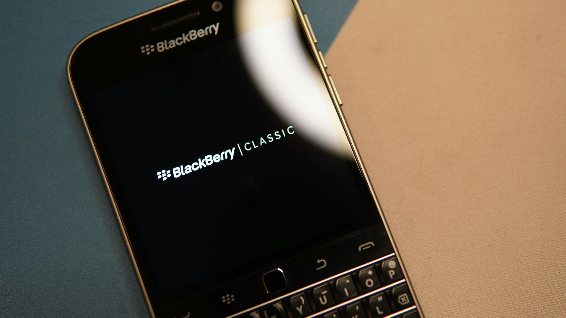 black and silver blackberry qwerty phone