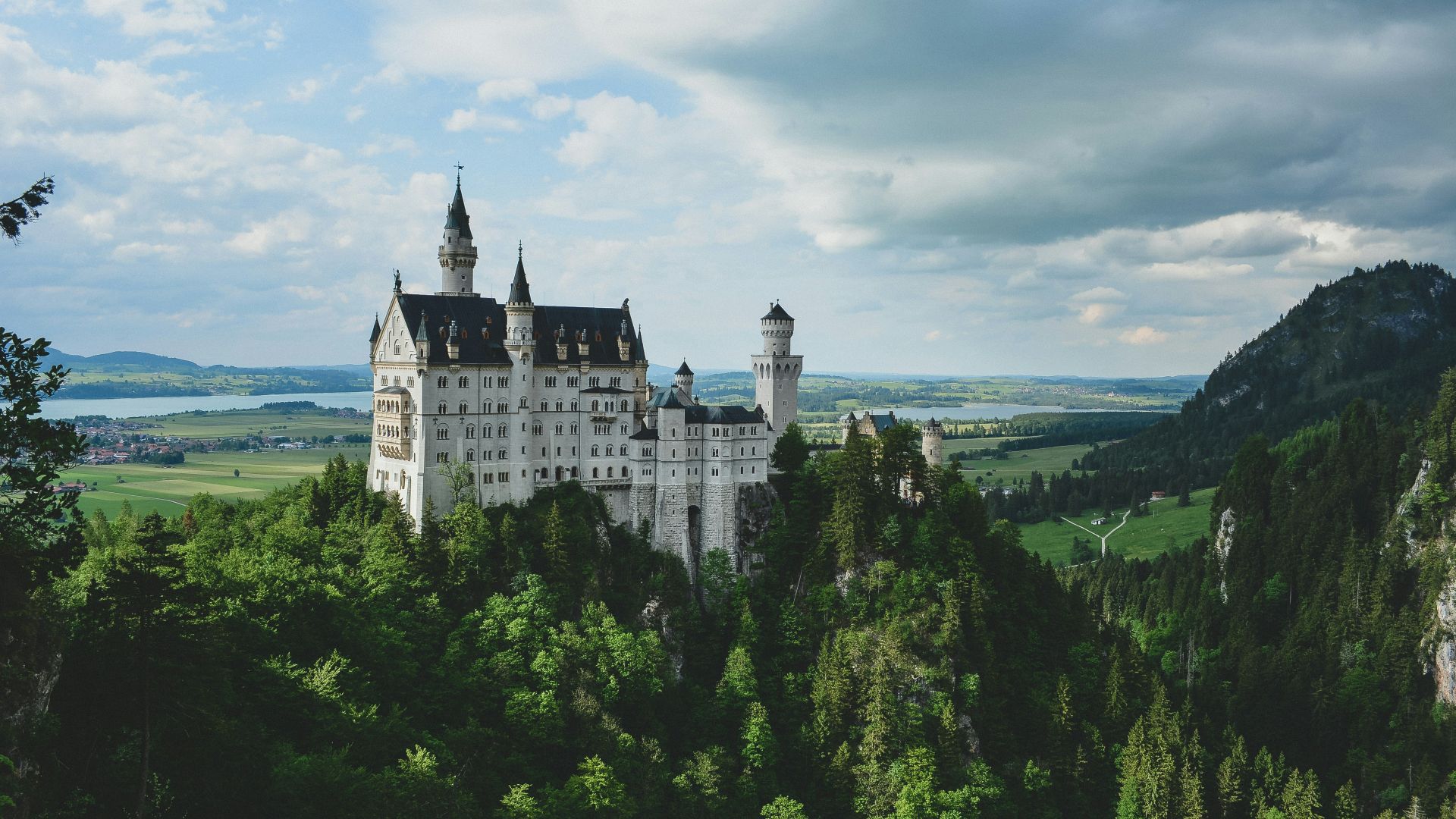 white concrete castle in green field