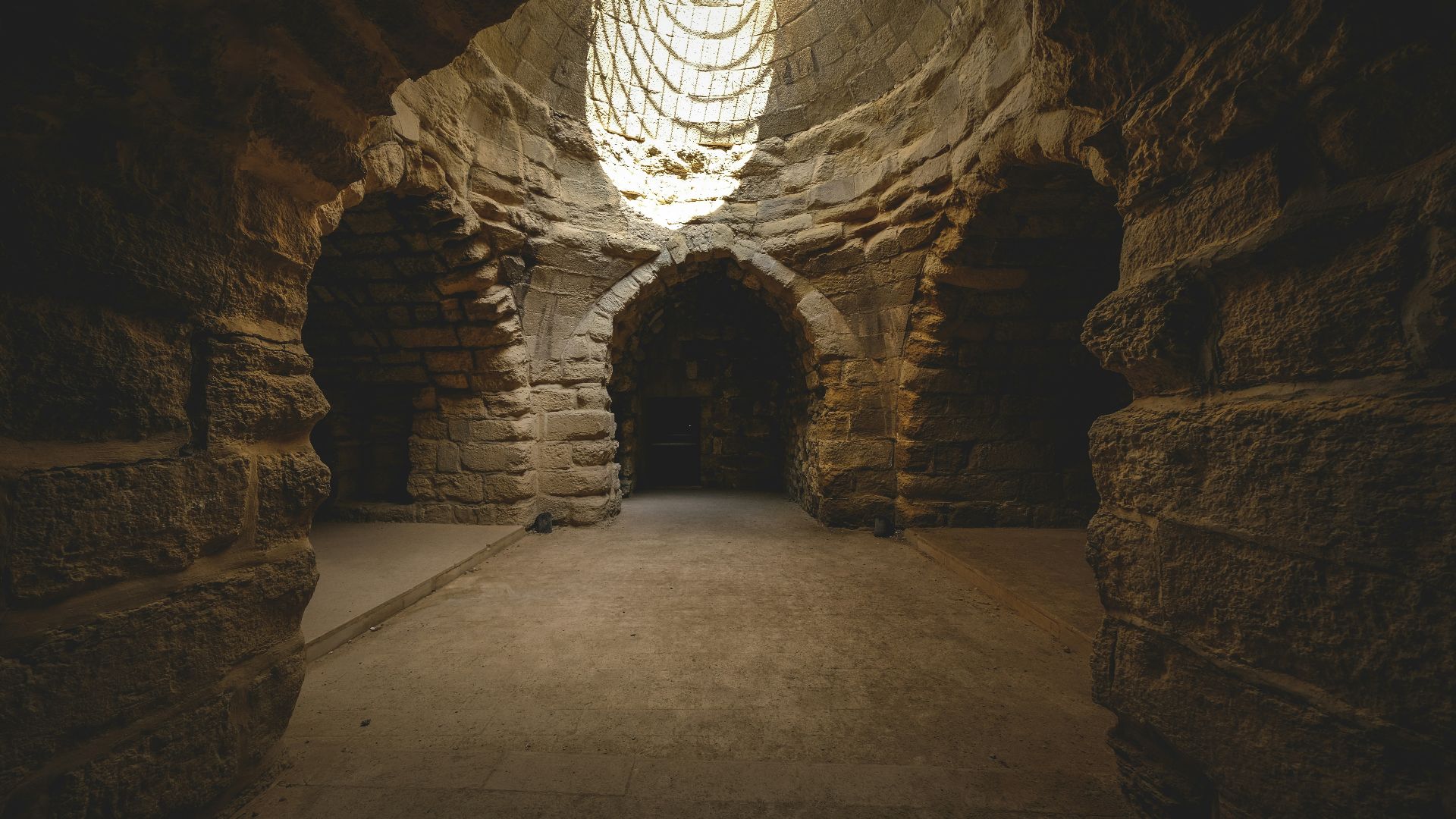 a dark tunnel with a light at the end