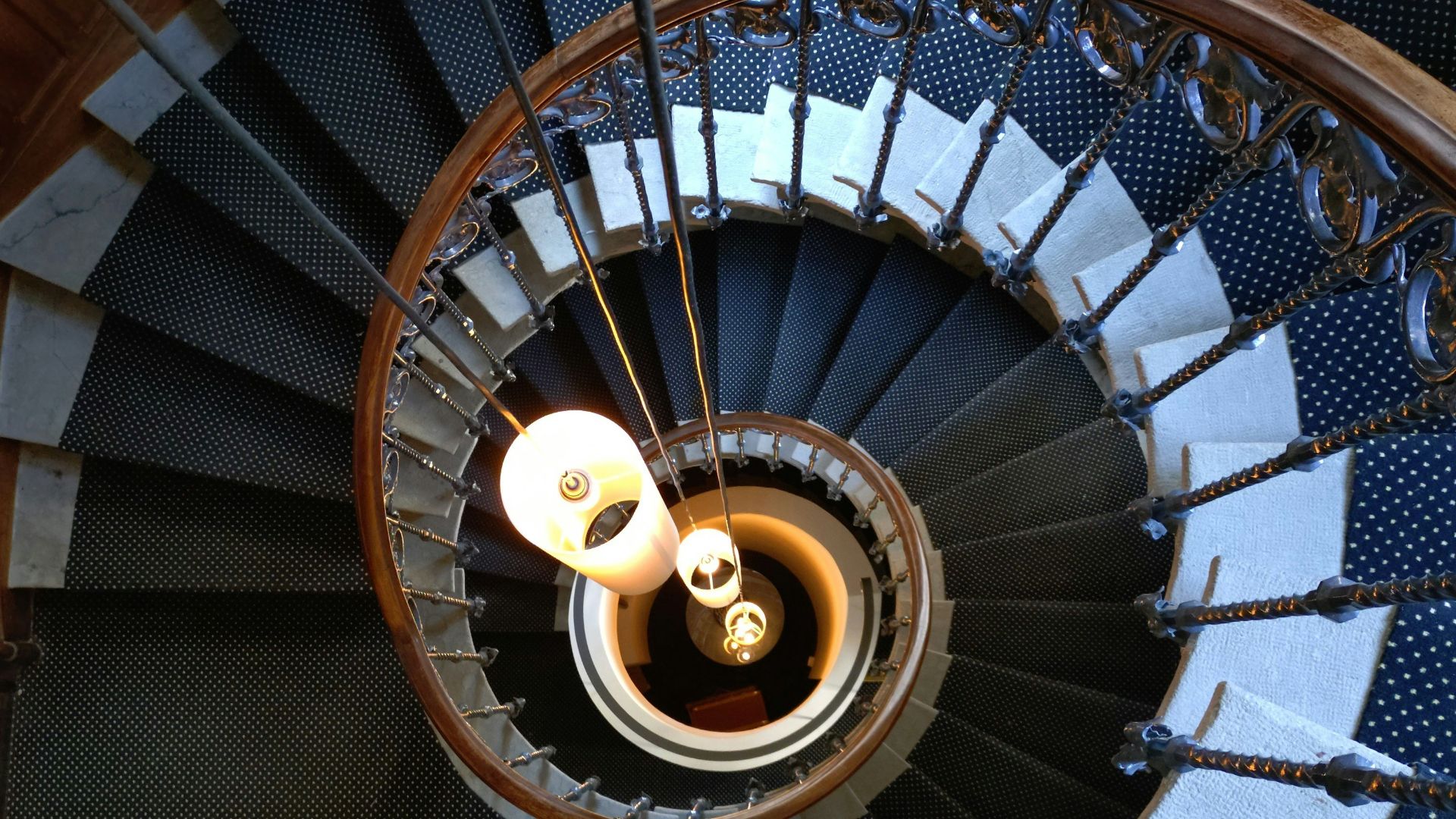 Spiral staircase with lights viewed from above
