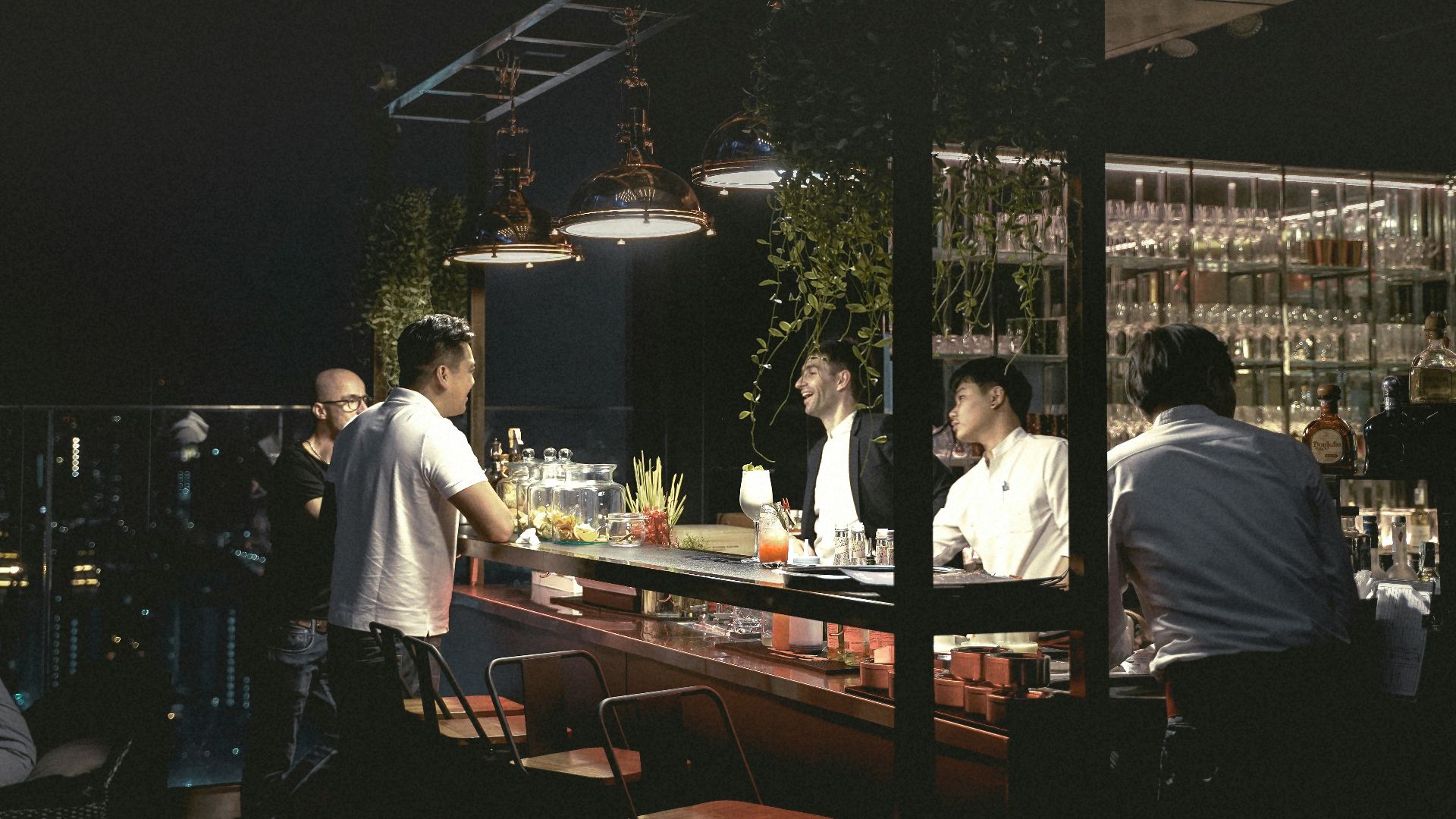 men sitting on bar stools