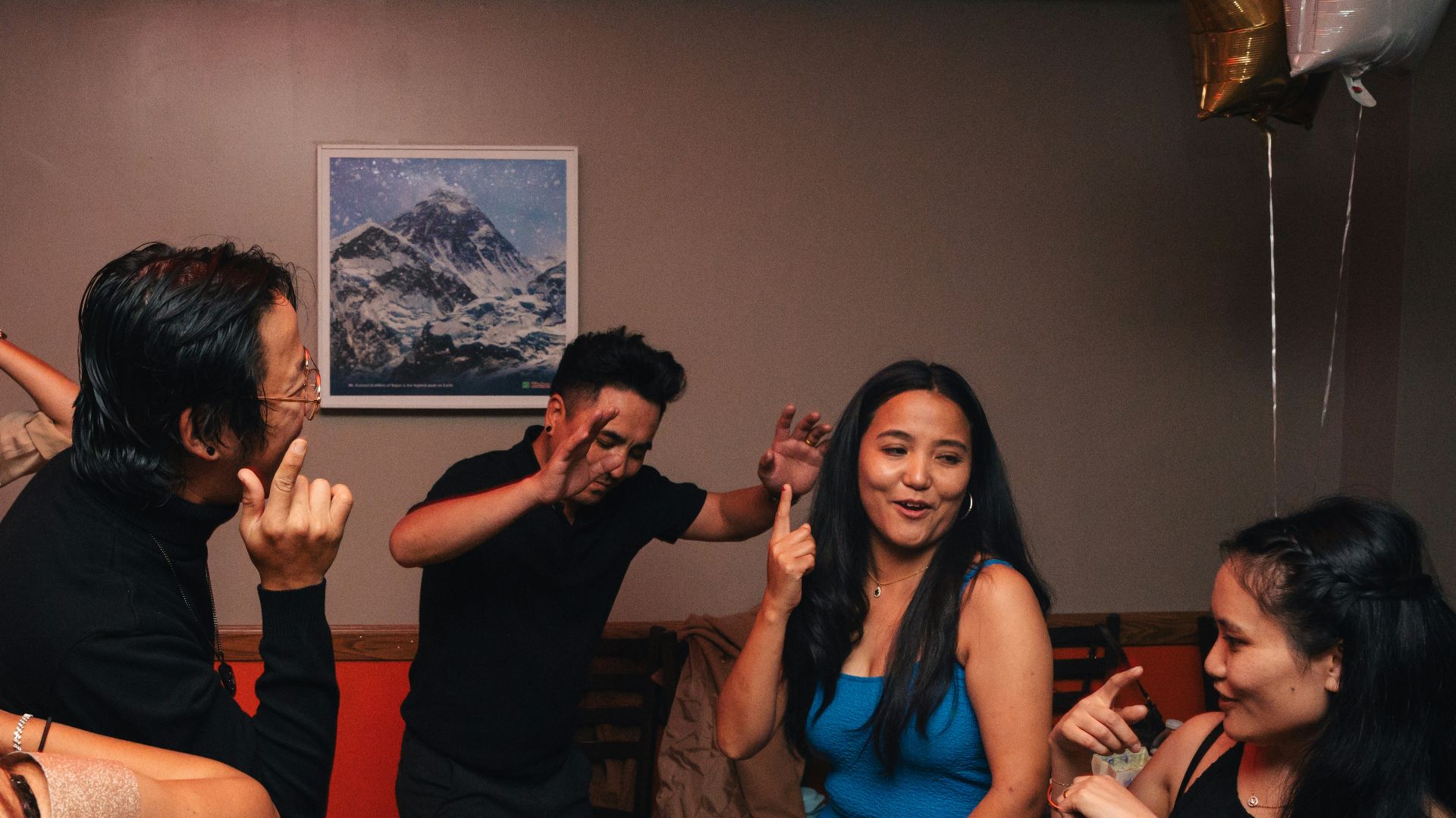 A group of people dancing in a room