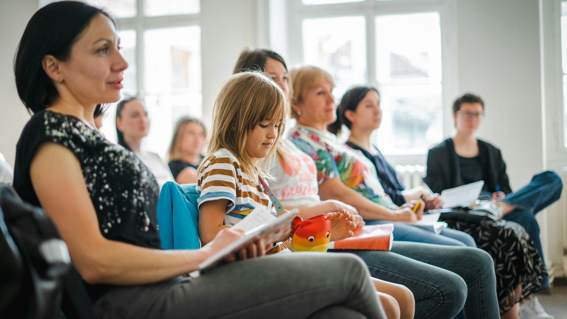 a group of people sitting in a room