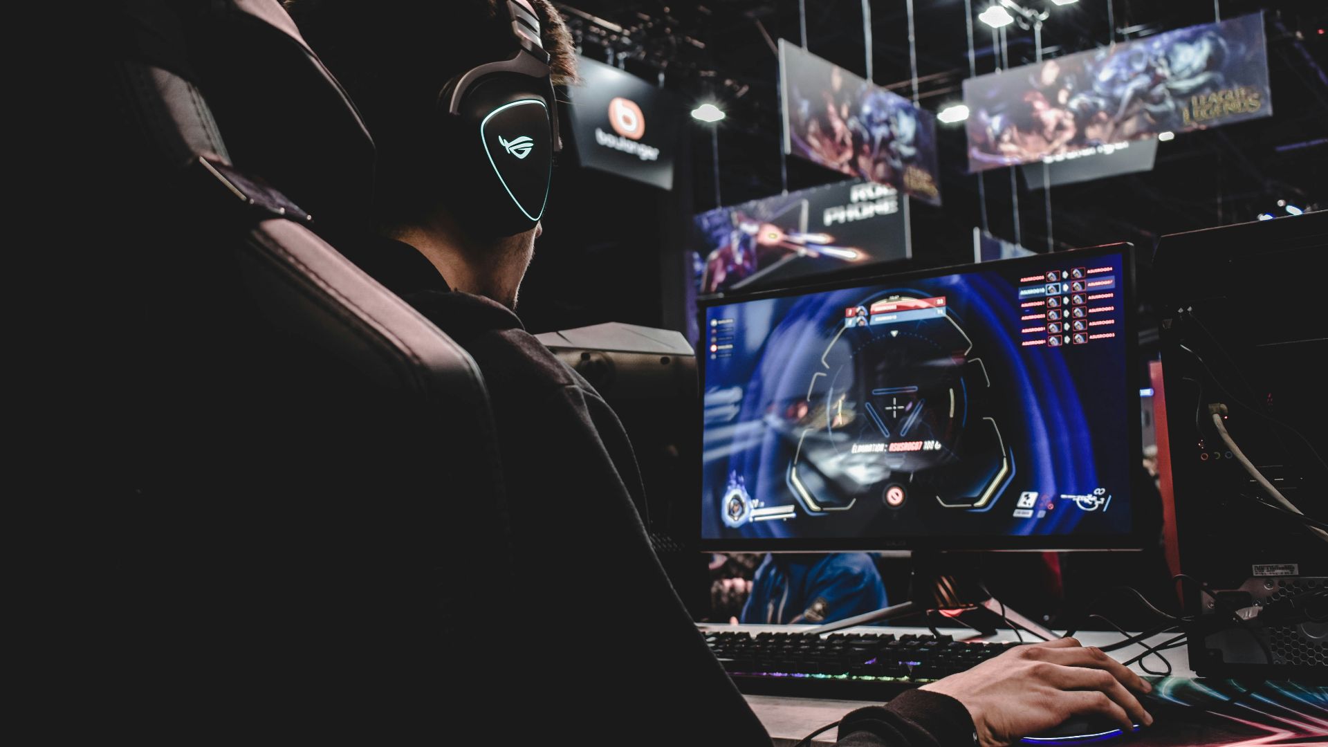 person sitting on gaming chair while playing video game