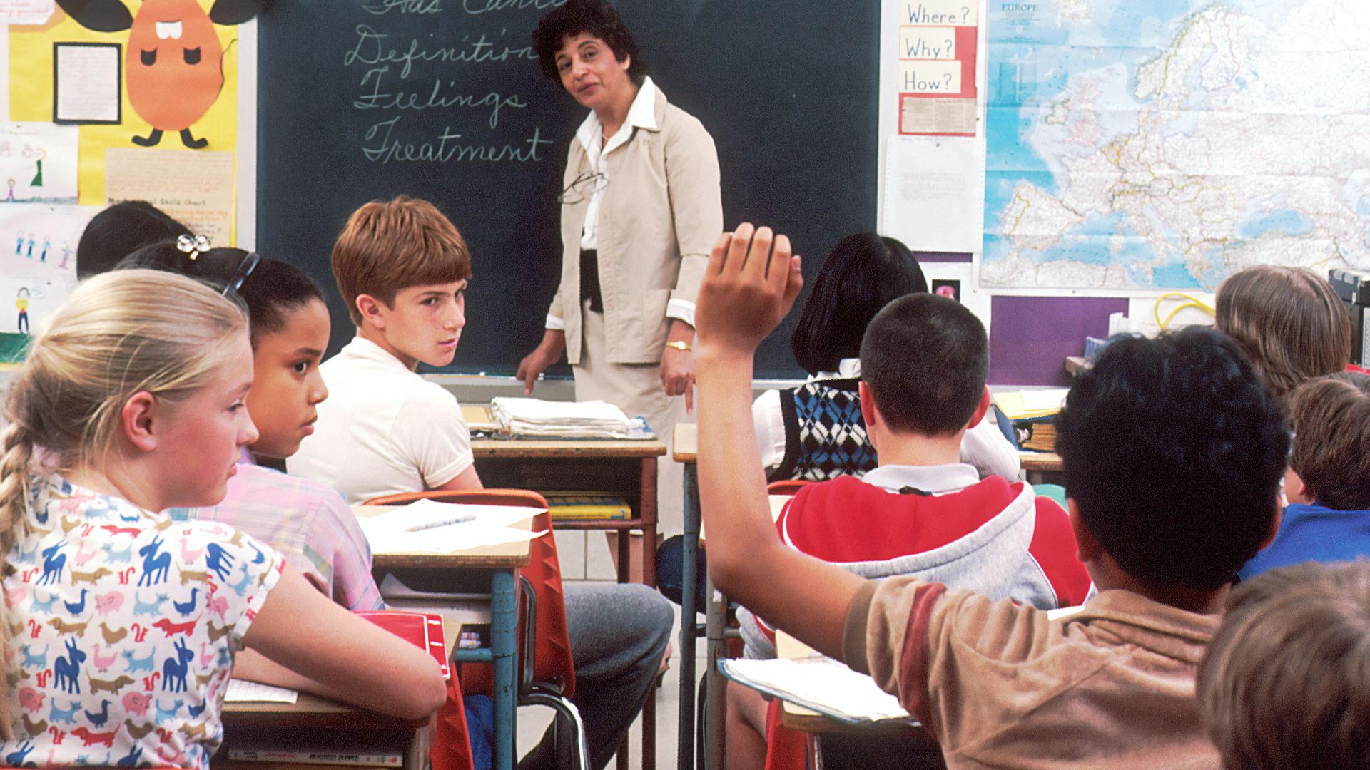 woman standing in front of children