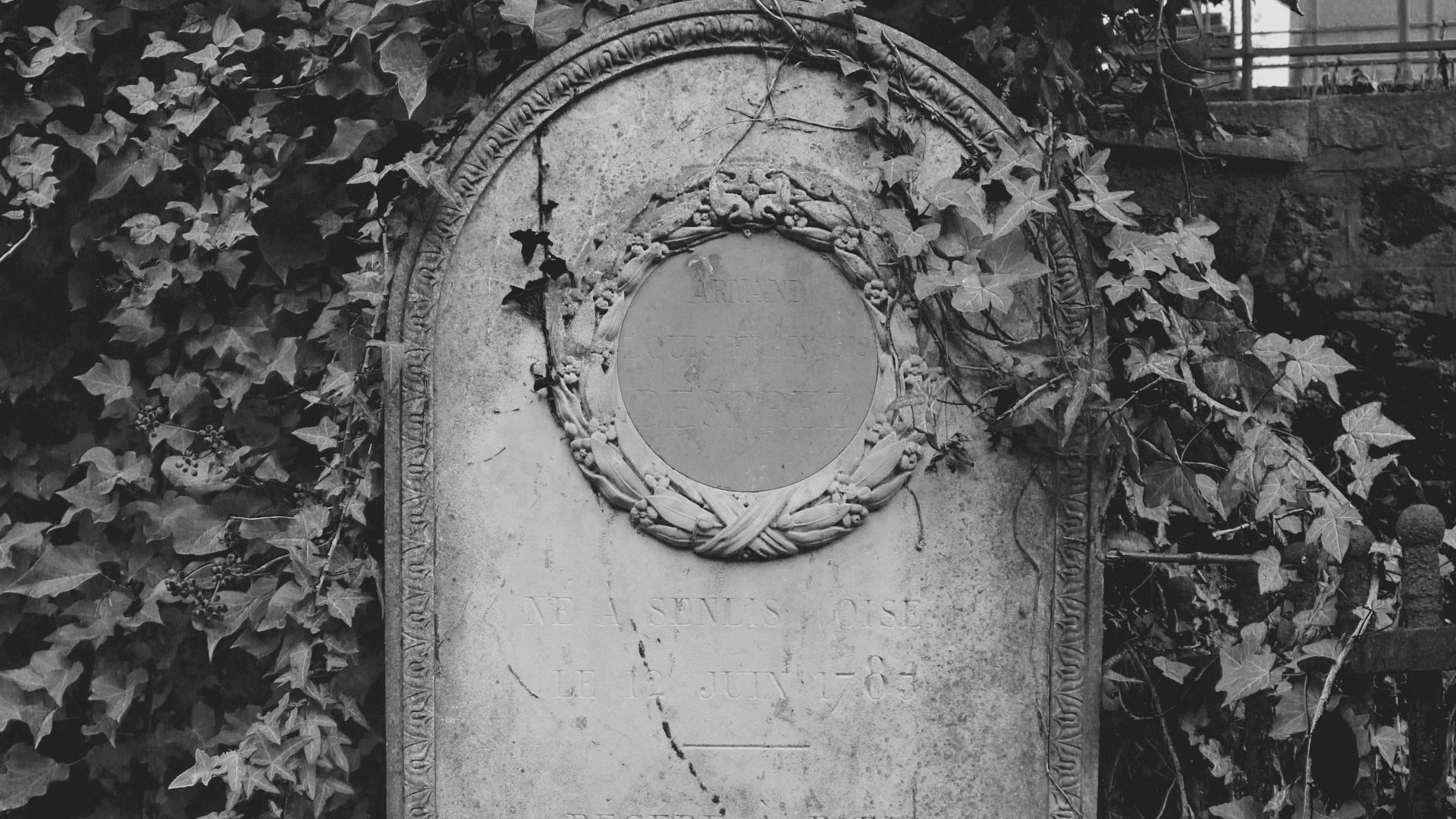 grayscale photo of concrete wall with hole