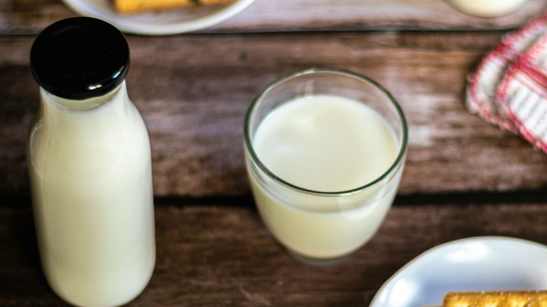 a plate of crackers and a glass of milk