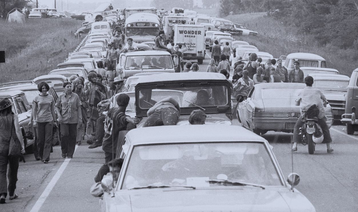 Gettyimages - 56716460, On The Road To Woodstock Members of the American youth subculture generally termed 'hippies' walk along roads choked with traffic on the way to the large rock conert called Woodstock, Bethel, New York, August, 1969. Some may get rides in or on the vehicles of likeminded motorists.