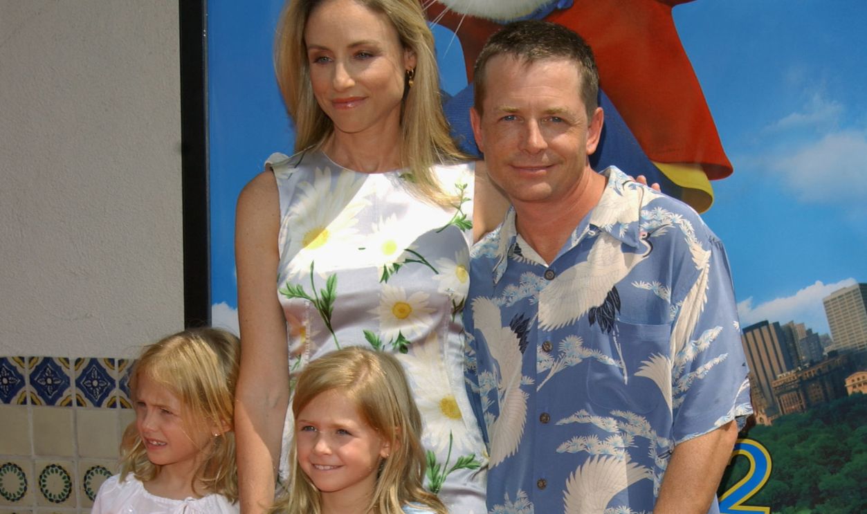Actor Michael J. Fox arrives with his wife, actress Tracy Pollan and their twins, Aquinnah (L) and Schuyler, 7, at the premiere of the movie 