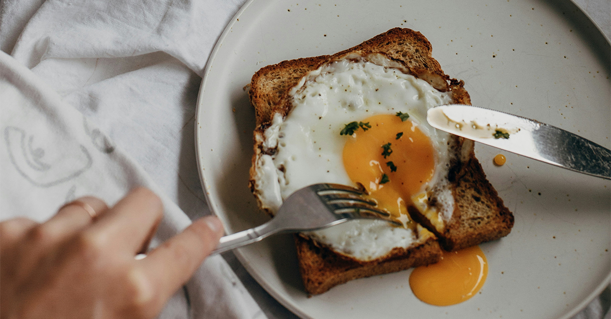 What is white on the outside, soft on the inside, and golden in the heart?