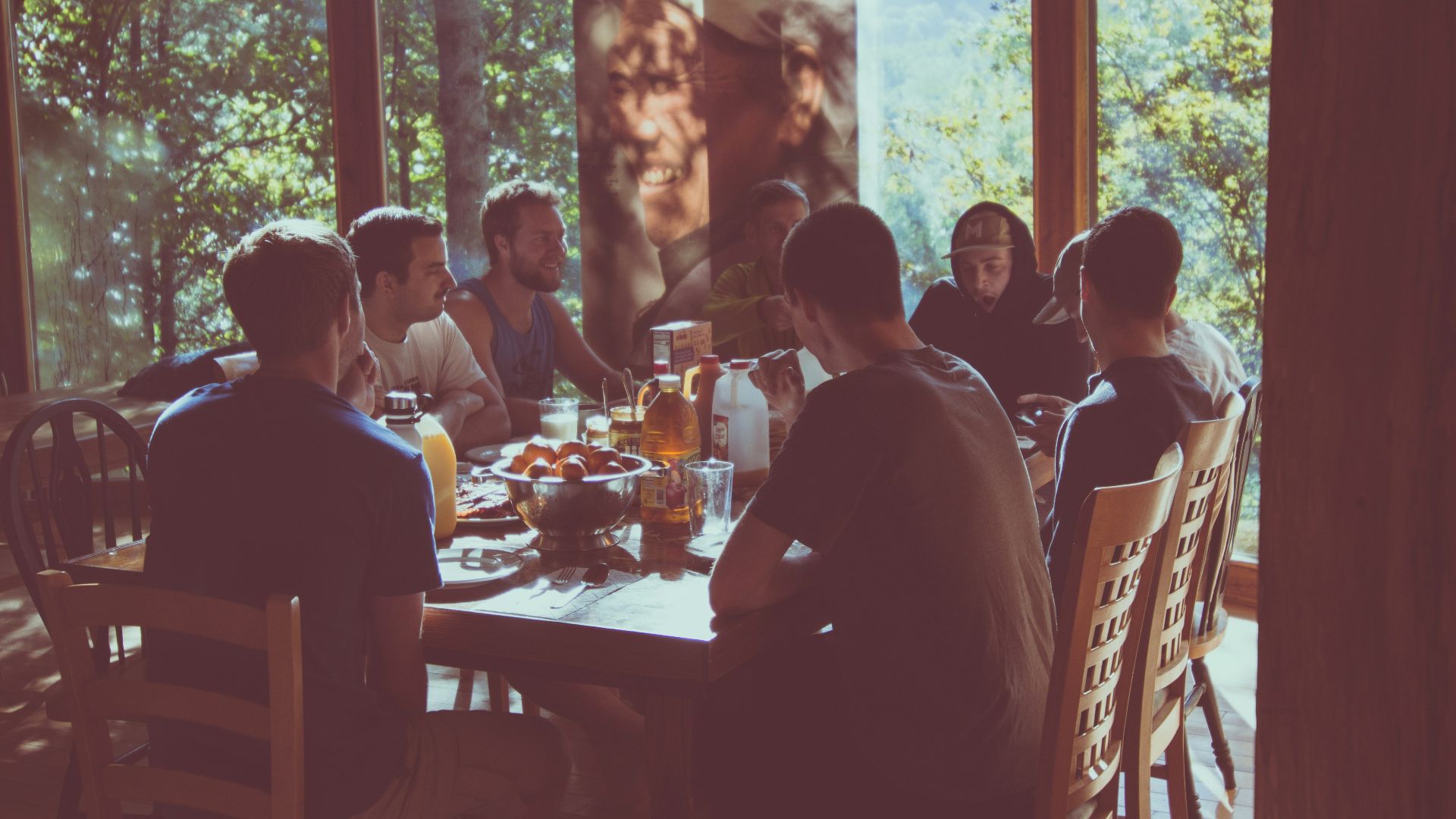 a group of people eating in a restaurant