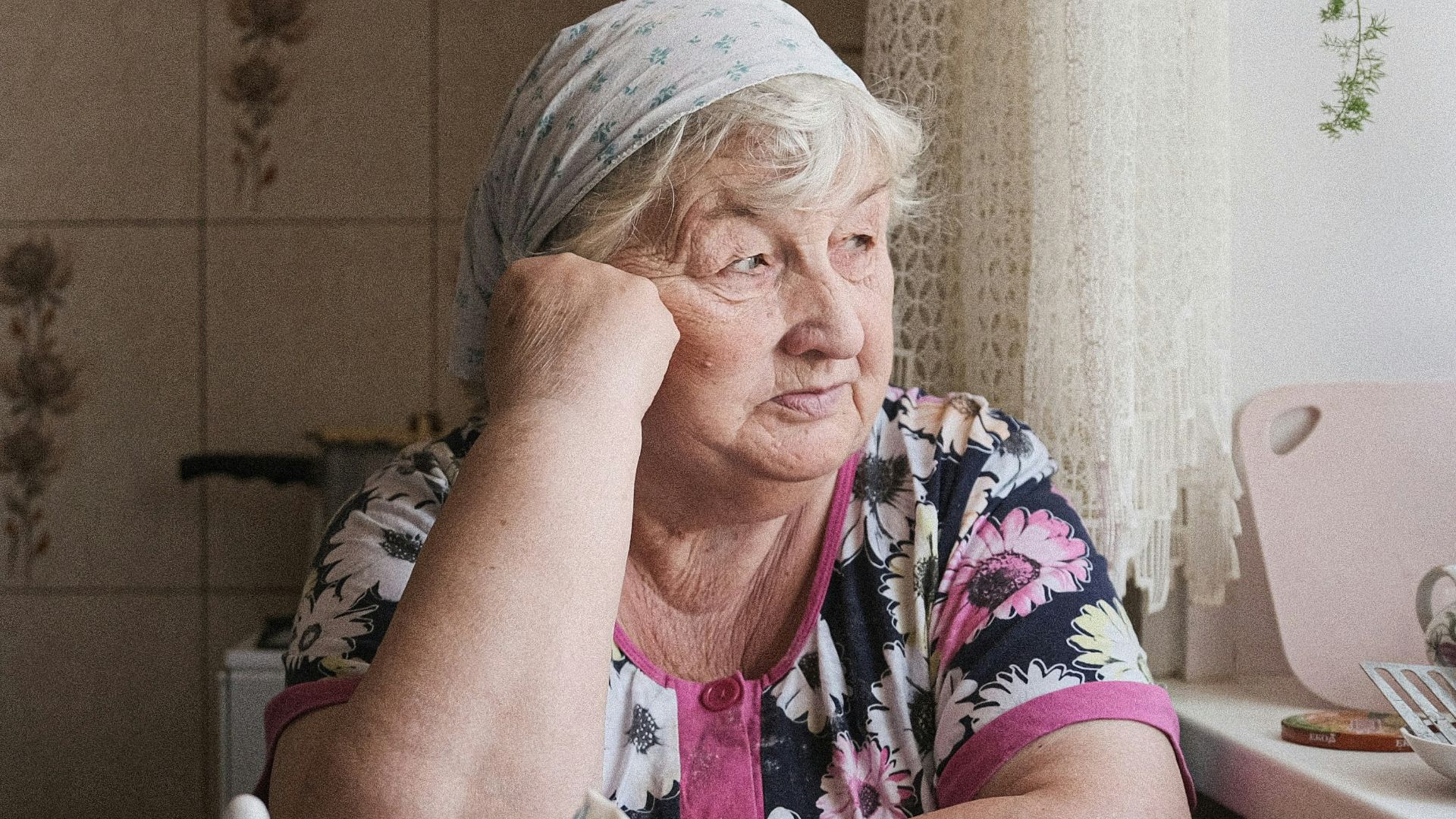 a man sitting at a table with food on it