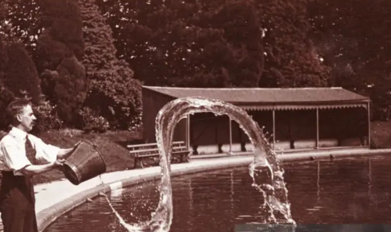 UNITED KINGDOM - AUGUST 06: Photograph by Frank Meadow Sutcliffe (1853-1941). An unusual image, this may well have been posed to allow Sutcliffe to experiment with capturing images at speed. It is perfectly timed to freeze the water in mid-air. Sutcliffe is best known for his naturalistic and spontaneous style of photography, especially his portrayals of Whitby's fishing community. He was a founder member of The Linked Ring Brotherhood and was made an Honorary Fellow of the Royal Photographic Society in 1941. 