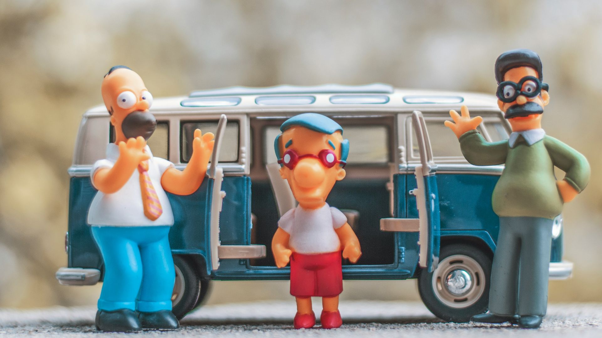 a group of figurines are standing in front of a van