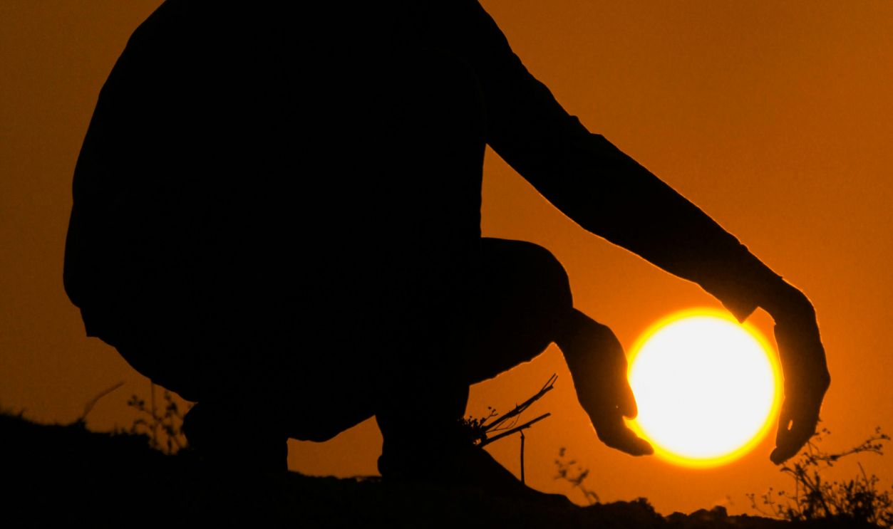 Holding The Sun At Sunset