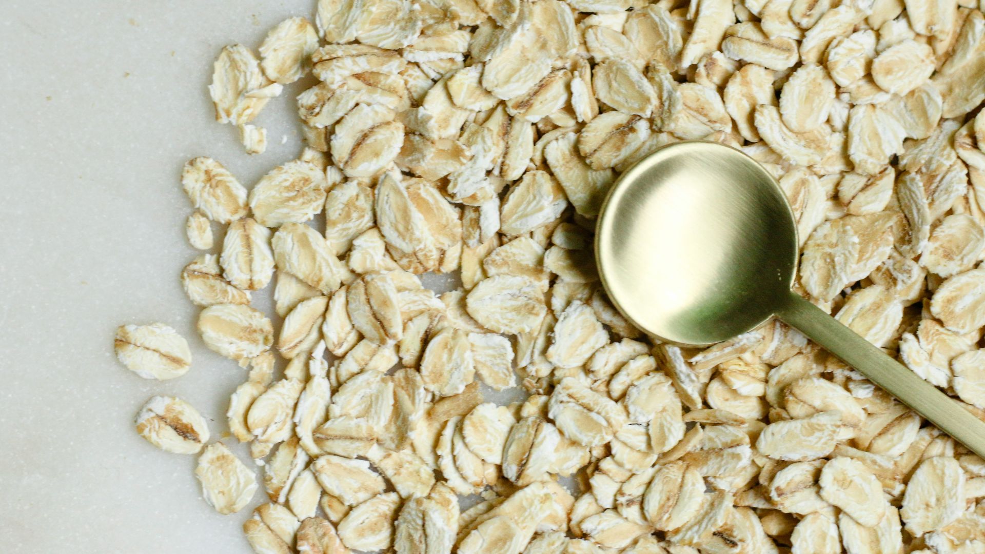 brown rice on white textile