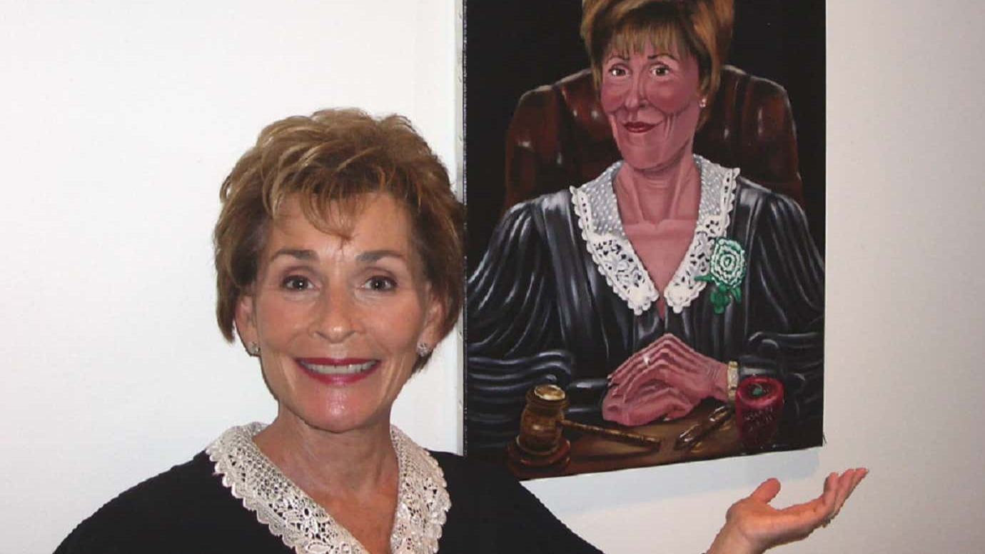 Photo of Judge Judy next to an 18 x 24 oil portrait by Susan Roberts