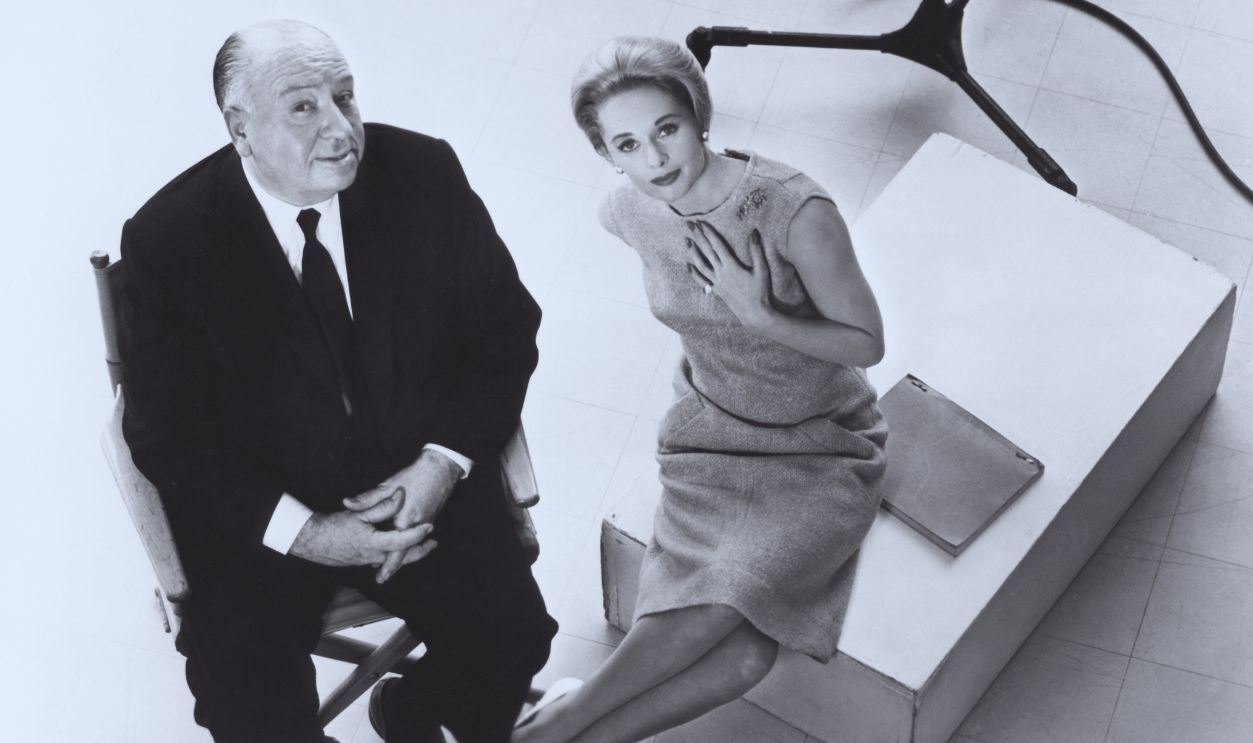 Gettyimages - 607399620, On the set of The Birds American actress Tippi Hedren with British director and producer Alfred Hitchcock on the set of Hitchcock's movie The Birds. 