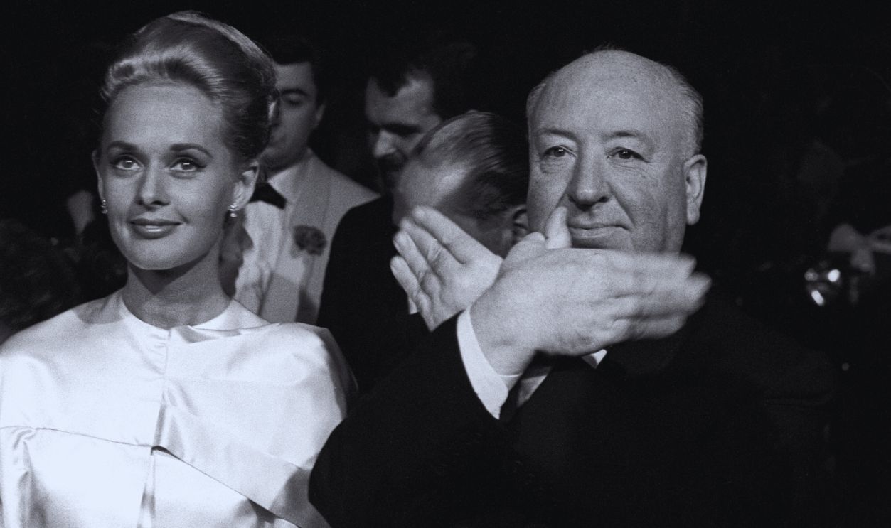 Gettyimages - 478439622, Cannes film festival 1963 Tippi Hedren and Alfred Hitchcock miming a bird in the Cannes film festival, on the occasion of the presentation of the movie 