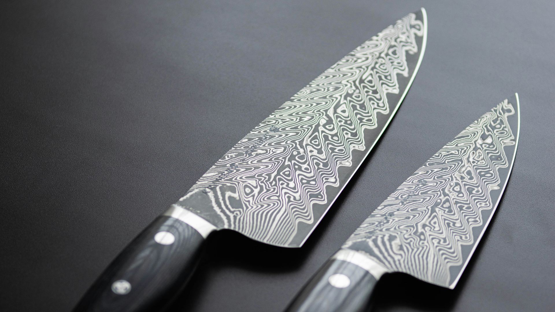 a pair of knives sitting on top of a table